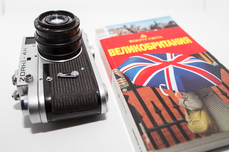 Retro photo camera and guidebook