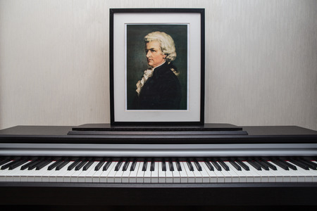 2018.11.28, Moscow, Russia. Mozart portrait on the piano. A composition of the composer portrait on the piano keyboard.のeditorial素材