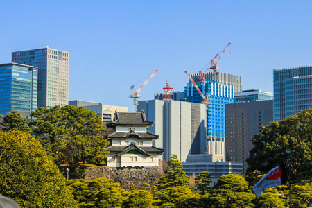 2013.01.02, Tokyo, Japan. The Emperor Palace of Japan on the background of skyscrapers. Modern and ancient architecture of Tokyo.のeditorial素材