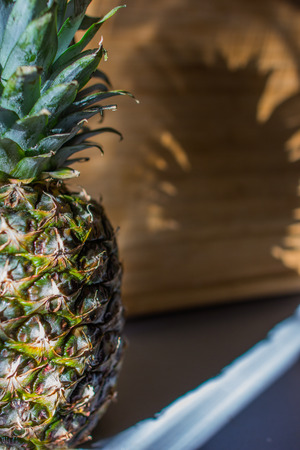 Pineapple on the table on wooden desk.の写真素材