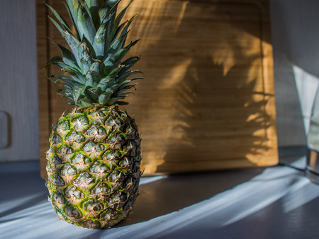 Pineapple on the table on wooden desk.の写真素材