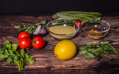 Ingredients for cooking Tabbouleh - Levantine vegetarian salad. Traditionally food of the Arabic world.の写真素材