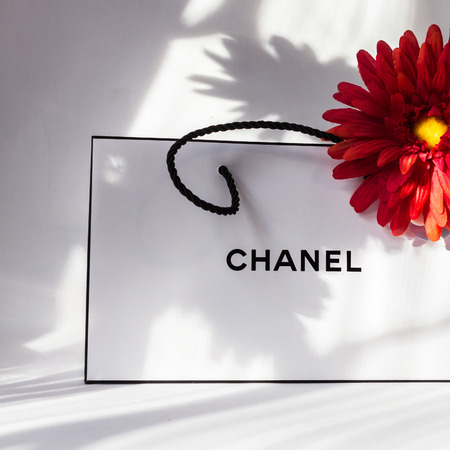 2019.03.07, Moscow, Russia. White bag of chanel and flower
