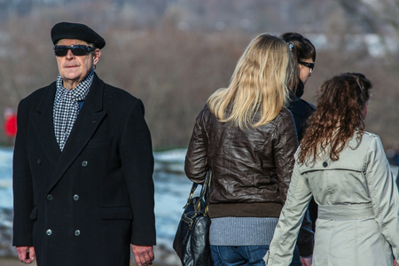 2010.03.27, Moscow, Russia. An old man wearing a black coat and sunglassesのeditorial素材