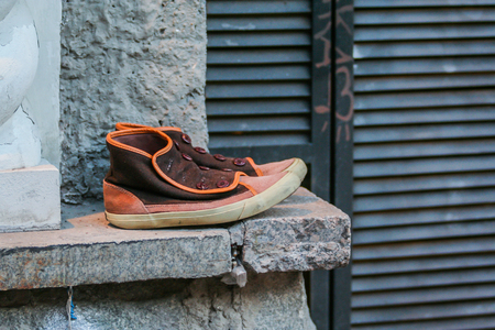 2010.04.10, Moscow, Russia. An old shoes on the wall.のeditorial素材