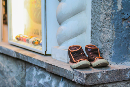 2010.04.10, Moscow, Russia. An old shoes on the wall.のeditorial素材