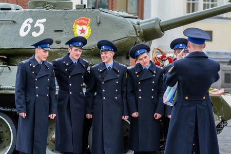 2010.04.18, Moscow, Russia. Young cadets are photographed on the background of the tank. Attractive Russian guys.のeditorial素材