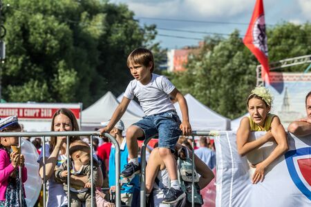 2019.06.01, Moscow, Russia. Children watching the battle of two teams. Young fans at sportive competition. Children Protection Day.のeditorial素材