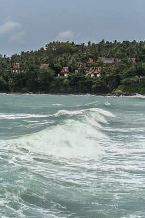 Waves on background of forest and mountains. Travel around Asia.の写真素材