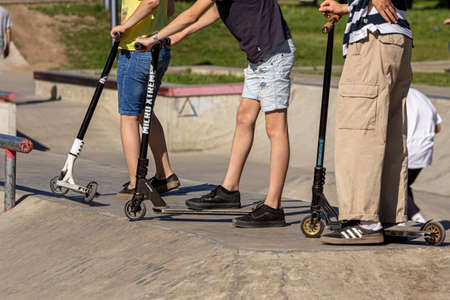 05/26/2018, Moscow, Russia. Group of different age boys riding a scooter at a skatepark. Active lifestyle of modern russian children.のeditorial素材