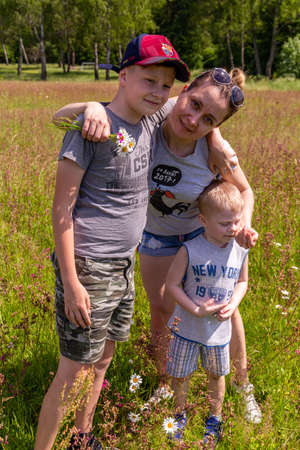 06.24.2020, Maloyaroslavets. Russia. Group portrait of a happy family on the field.のeditorial素材