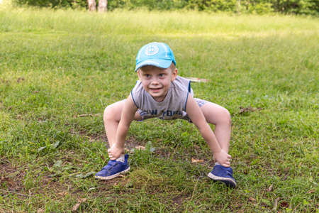 06.24.2020, Maloyaroslavets. Russia. A little boy playing charades - a parlor or party word guessing game on the open air.のeditorial素材
