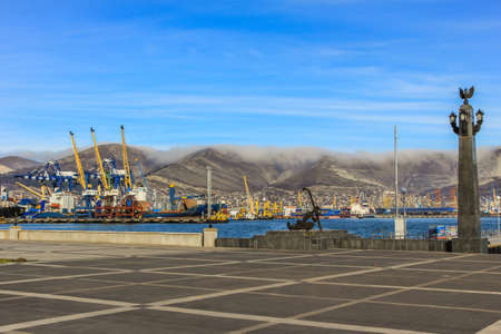 12/09/2012, Novorossiysk, Russia. Seascape by the shore against the background of the cruiser and mountains.のeditorial素材