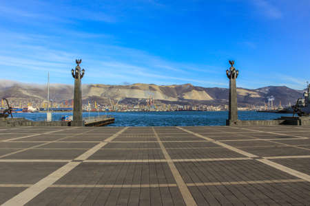 12/09/2012, Novorossiysk, Russia. Seascape by the shore against the background of the cruiser and mountains.のeditorial素材