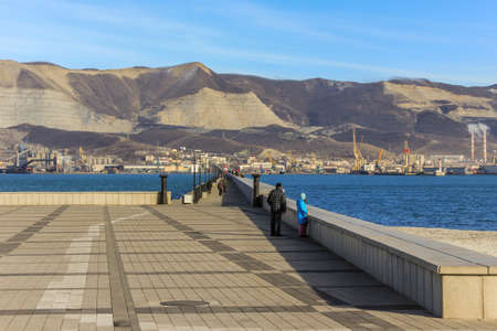 12/09/2012, Novorossiysk, Russia. Seascape by the shore against the background of the cruiser and...
