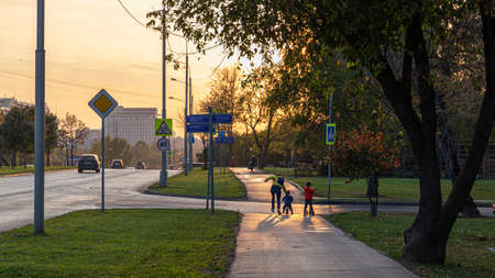 02.10.2020, Moscow, Russia. A cars moving on the road on background of sunset.