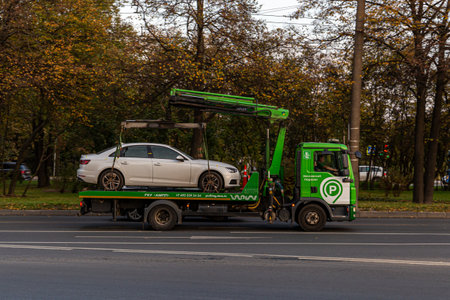 02.10.2020, Moscow, Russia. A tow truck service takes a passenger car to the impound lot.のeditorial素材