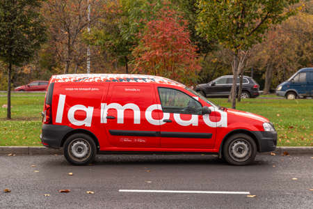 11.10.2020, Moscow, Russia. A red delivery car on the road, side view.のeditorial素材