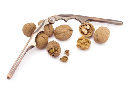 nutcracker and walnuts on a white background