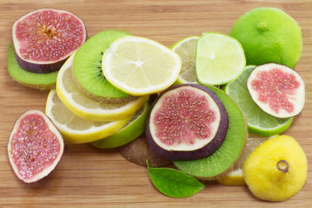 kiwi, lemon, fig  on a white backgroundの写真素材