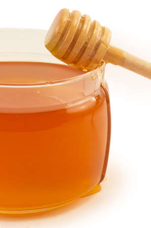 sweet, delicious honey in glass jarの写真素材