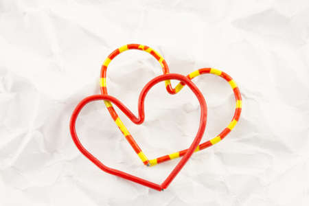 red heart on a background white crumpled office paperの写真素材