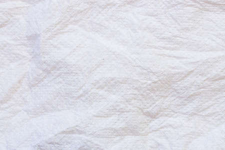 background crumpled sheet of white paperの写真素材