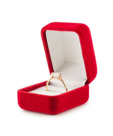 gold wedding ring in a red gift box