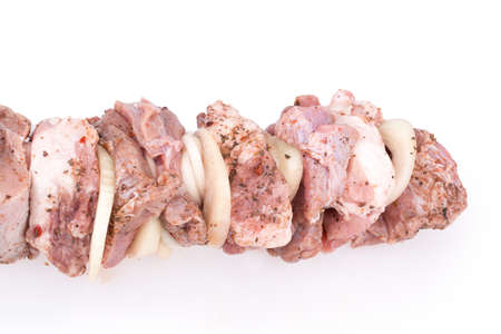 Isolated raw meat on the metal skewerの写真素材