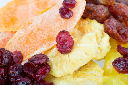 dried fruit pineapple, lemon, walnut, cranberry isolated on white backgroundの写真素材