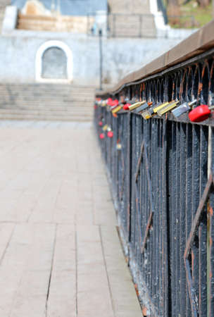 many locks on the metal fence
