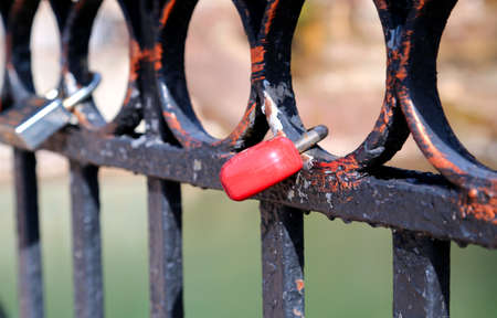 many locks on the metal fenceの写真素材