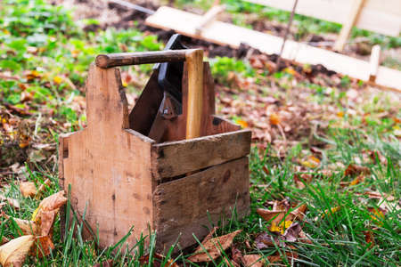 wooden box tools in the grassの写真素材