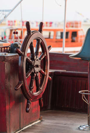 ship wheel brown shiny woodの写真素材