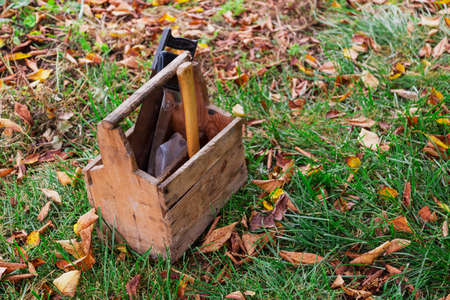 wooden box tools in the grassの写真素材