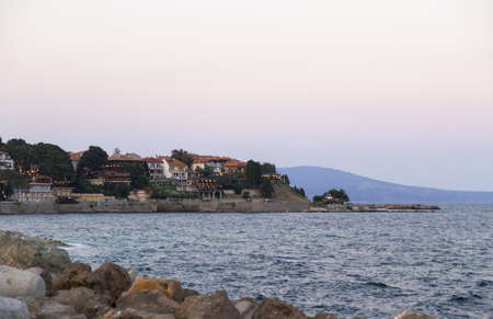 sun set over the city by the seaの写真素材