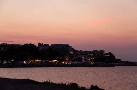 sun set over the city by the seaの写真素材