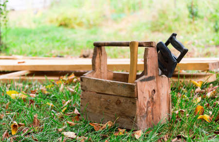 wooden box tools in the grassの写真素材