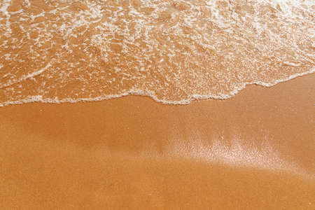 Soft wave of the sea on the sandy beachの写真素材