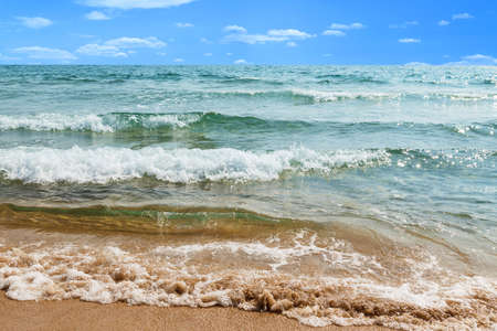 sandy beach, sea shore with waves