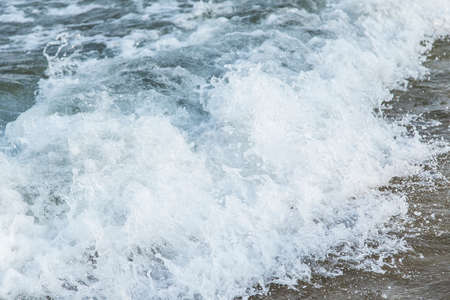 sand, sea, sky waves, clouds summer vacationの写真素材
