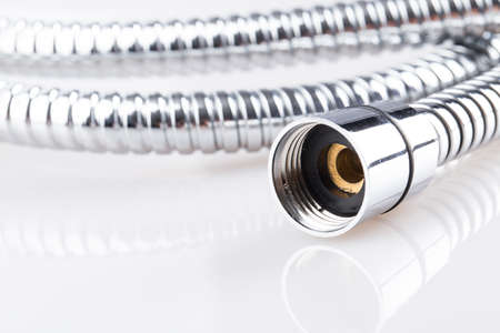 corrugated hose shower Isolated on white backgroundの写真素材