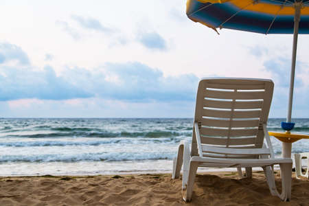 lounger parasol beach sea skyの写真素材