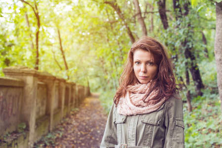 Park woman autumn path outsideの写真素材