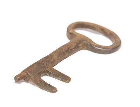 old rusty key isolated on white backgroundの写真素材