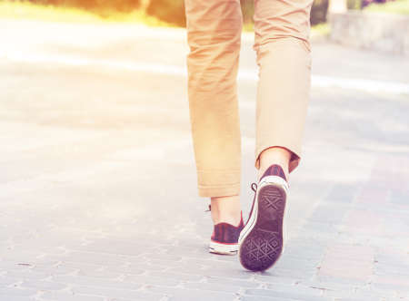 woman sunny walk legs gumshoesの写真素材