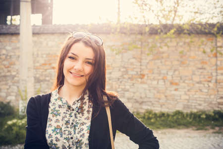 sunny portrait of a woman stone backgroundの写真素材
