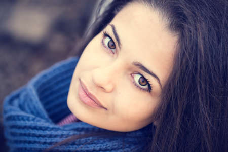 beautiful brunette woman portrait blue scarfの写真素材