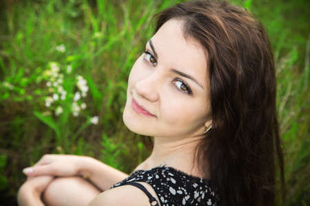 sunny portrait of a girl in the parkの写真素材