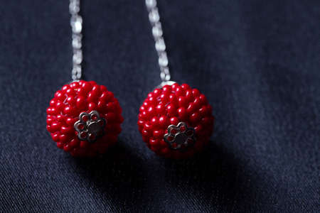 red coral beads earrings Isolated on white background